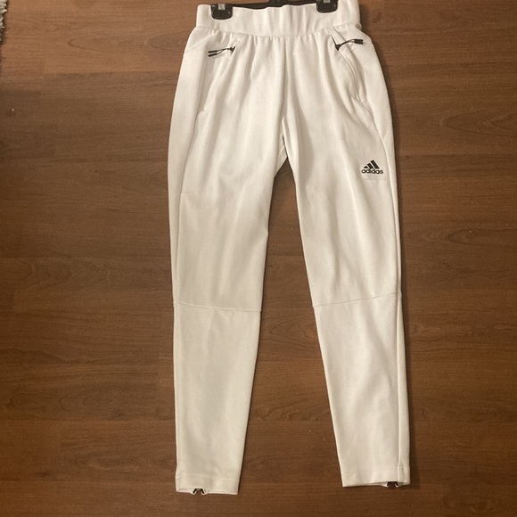 White sporty suit of the brand Adidas. It’s an X-small. Never wear and new. - Picture 3 of 3